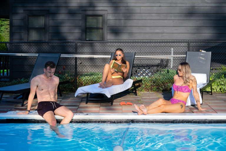 A group of people relaxing in a swimming pool.