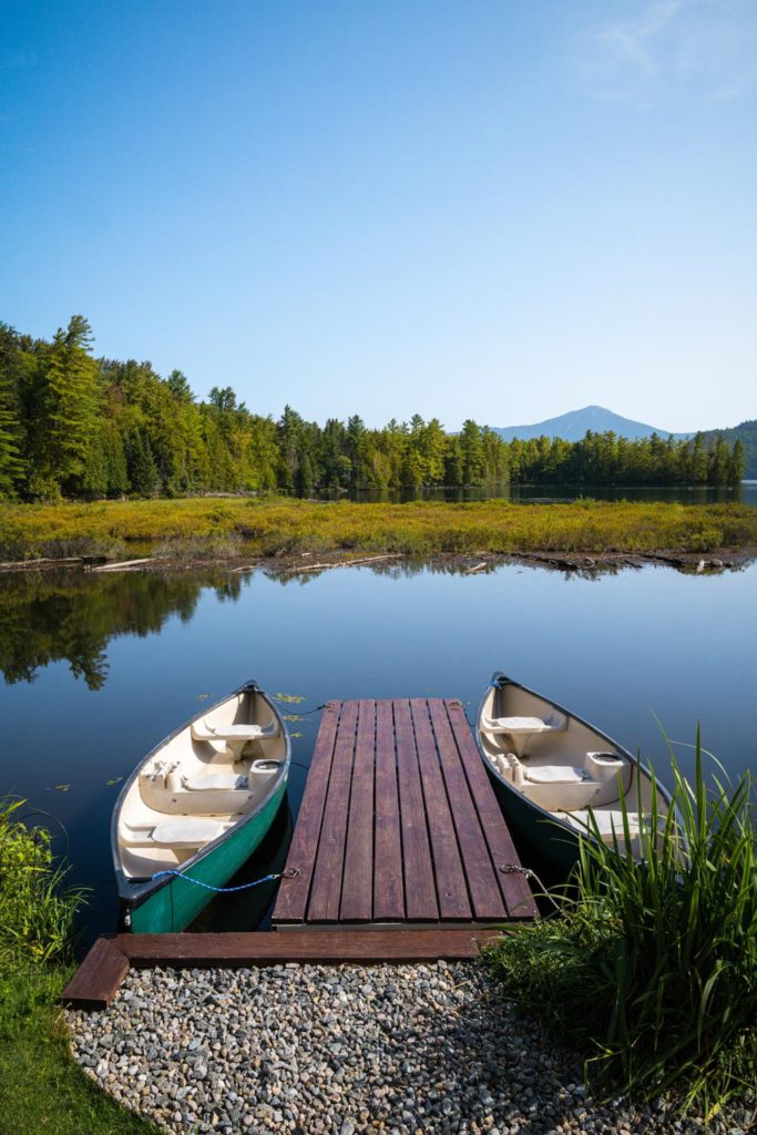 Two canoes docked on a dock.