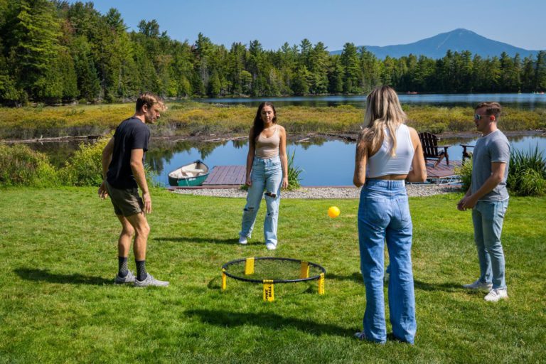 A group of people playing a game of frisbee.