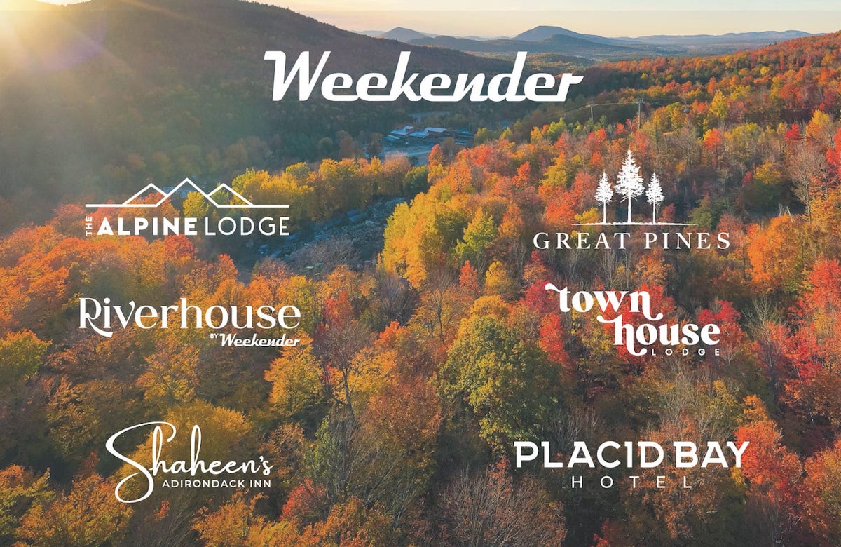 Weekender logos in the fall with mountains in the background.